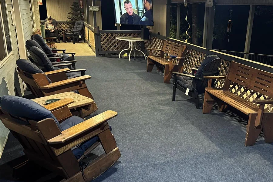 A night view of the same porch, fully lit and easy to enjoy after dark.